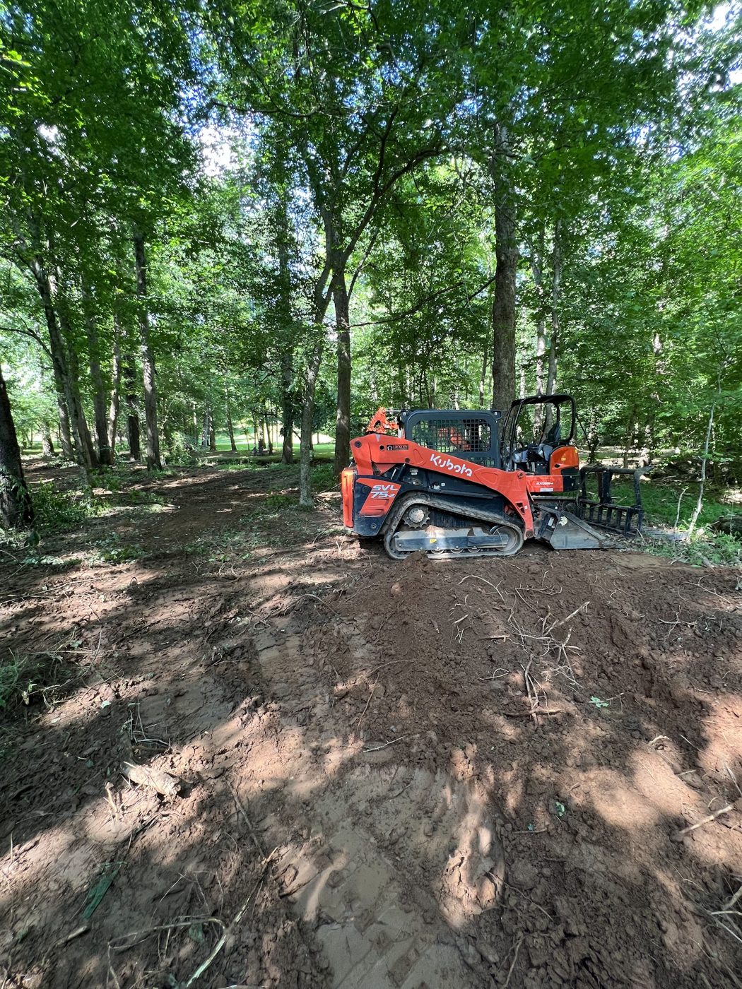 Land clearing with a skid steer
